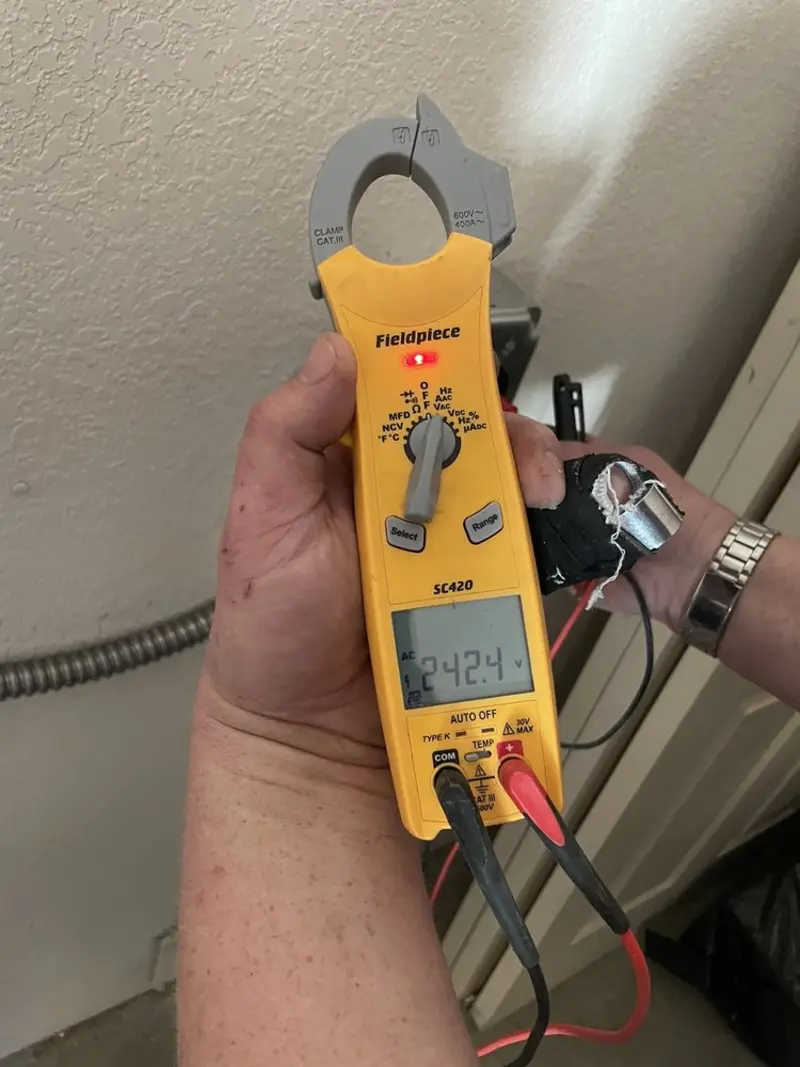Voltage testing with clamp meter during Generator Installation in Georgetown